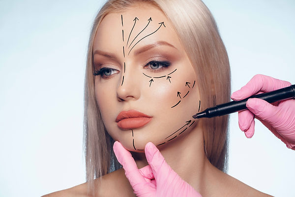 beautiful-blonde-woman-with-markings-for-plastic-surgery-on-her-face-woman-portrait.jpg