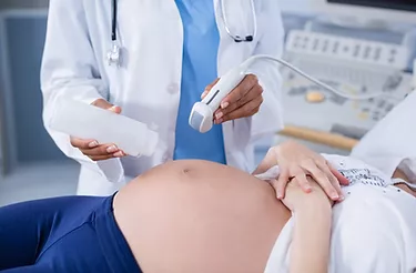 pregnant-woman-receiving-a-ultrasound-scan-on-the-stomach.png